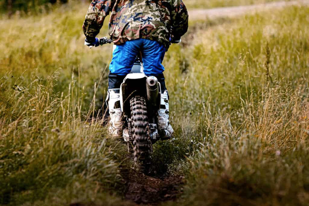 enduro rider going through a field
