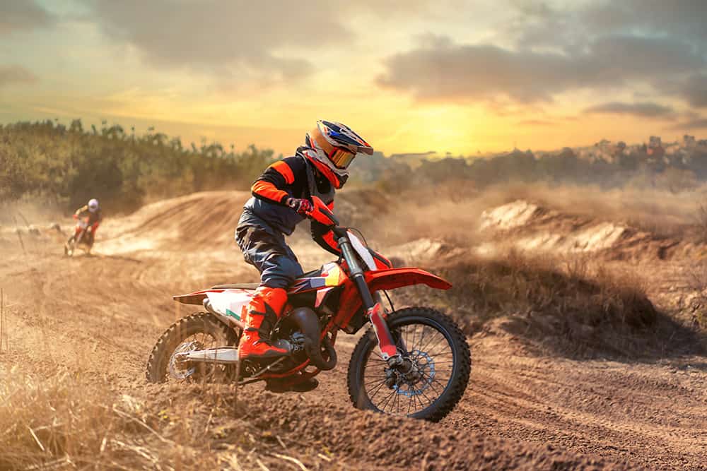 dirt bike riders going around a corner