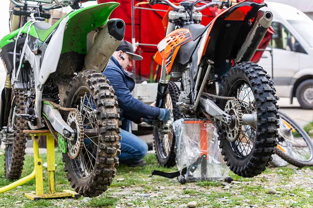 man working on bikes